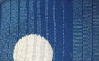 Fabric woven of cotton and wool. Clamped resist, indigo dyed.